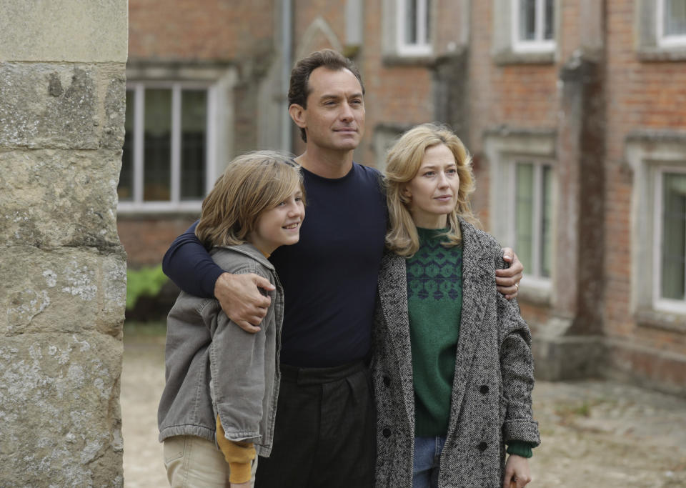 This image released by IFC Films shows, from left, Charlie Shotwell, Jude Law, and Carrie Coon in a scene from "The Nest." (IFC Films via AP)