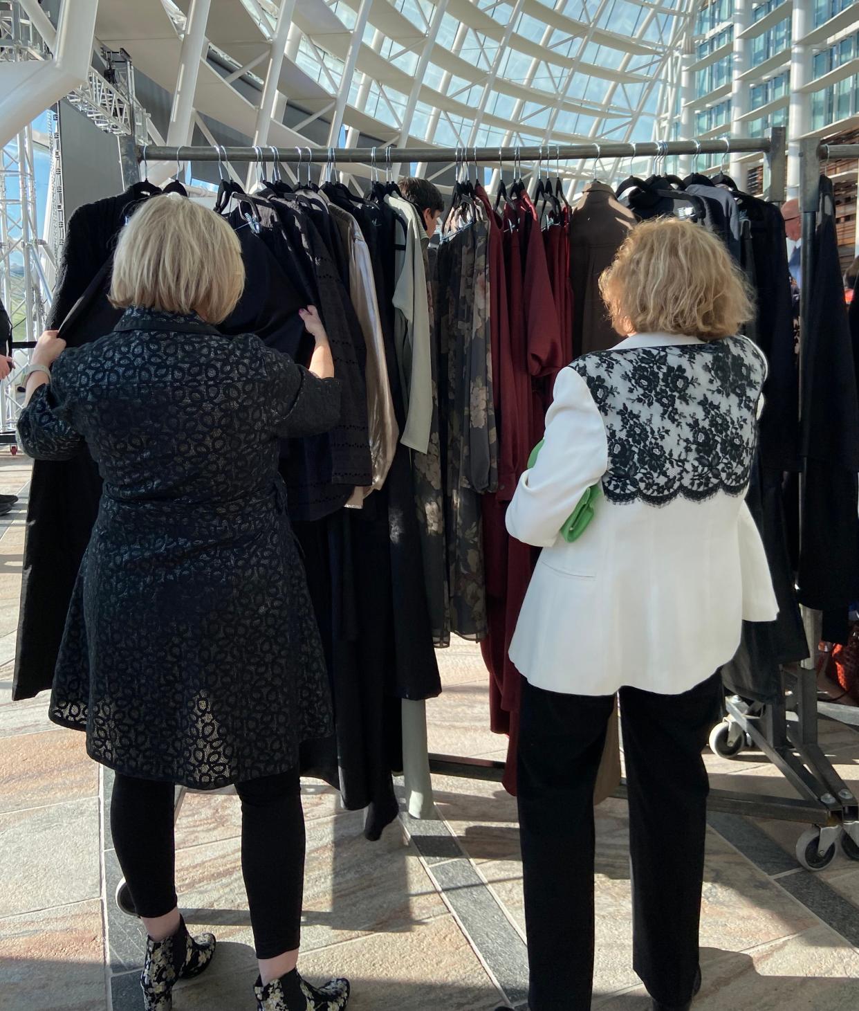 People explore Israeli clothing for purchase at the Oklahoma Israel Exchange's "Fashionably Tied" event at the First Americans Museum in Oklahoma City.