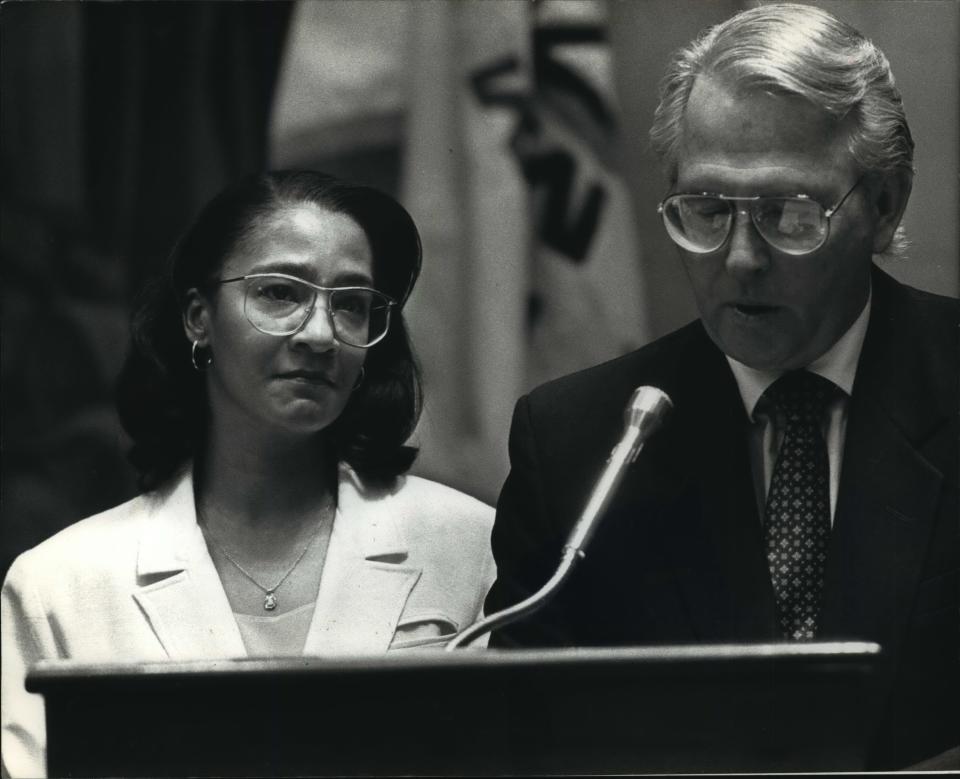 Glenda Cleveland listens as Milwaukee County Supervisor Thomas A. Bailey reads a County Board citation presented at the board meeting.  Cleveland was honored Thursday for her "compassionate concern" in pressing Milwaukee police for answers on the fate of a naked, injured 14-year-old boy, Konerak Sinthasomphone, who later was slain by serial murderer Jeffrey L. Dahmer.