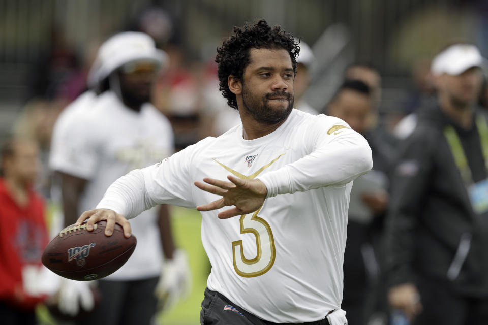 NFC quarterback Russell Wilson, of the Seattle Seahawks, fires a pass during a practice for the NFL Pro Bowl football game Thursday, Jan. 23, 2020, in Kissimmee, Fla. (AP Photo/Chris O'Meara)