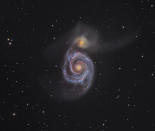 Australian photographer Martin Pugh captured this image of the Whirlpool Galaxy which combines fine detail in the spiral arms with the faint tails of light that show its small companion galaxy being gradually torn apart by the gravity of its giant neighbour. A closer look shows even more distant galaxies visible in the background.