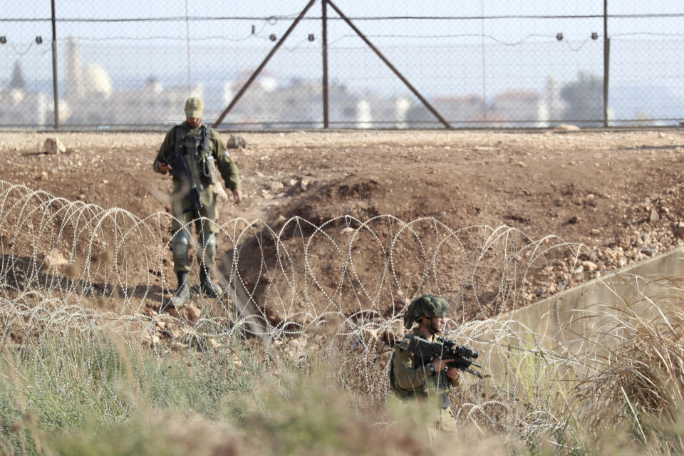 Israeli soldiers take positions along the border between the northern West Bank near Jenin and Israel as they search for two Palestinians who broke out of a maximum-security prison last week, on a road leading to the West Bank town of Jenin, near Gan Ner Israel, Sunday, Sept. 12, 2021. Israeli police on Saturday said they arrested four of the six Palestinians who broke out of the prison including Zakaria Zubeidi a famed militant leader whose exploits over the years have made him a well-known figure in Israel. (AP Photo/Ariel Schalit)