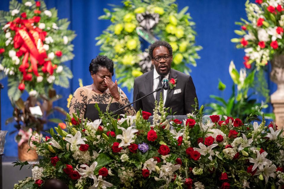 Luther Mercer Jr. tells a story about his mother as Tina Mercer cries during Shirlene Mercer's funeral reception inside Carl Perkins Civic Center on Wednesday, Aug. 9, 2023.