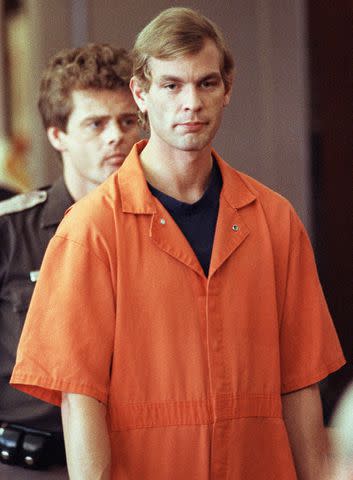 <p>Eugene Garcia/AFP/Getty</p> Jeffrey Dahmer enters the courtroom of judge Jeffrey A. Wagner on Aug. 6, 1991