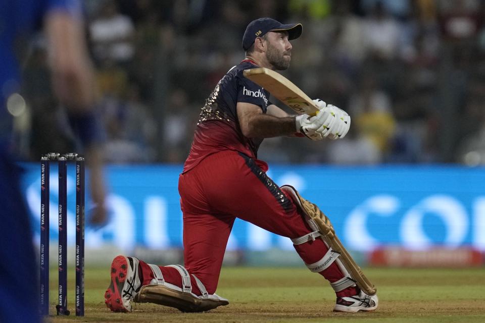 Royal Challengers Bangalore's Glenn Maxwell plays a shot during the Indian Premier League cricket match between Mumbai Indians and Royal Challengers Bangalore in Mumbai, India, Tuesday, May 9, 2023. (AP Photo/Rajanish Kakade)