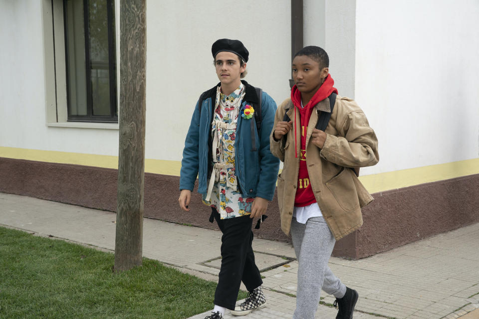 Jack Dylan Grazer and Jordan Kristine Seamon walk with backpacks on