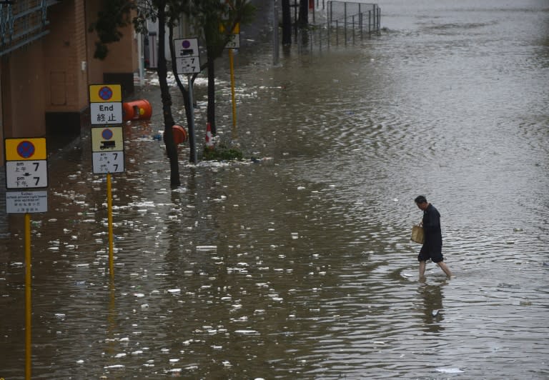 Heavy rains and driving winds brought localised flooding to parts of Hong Kong, but neighbouring Macau fared much worse, with at least three people known to have died in the huge storm