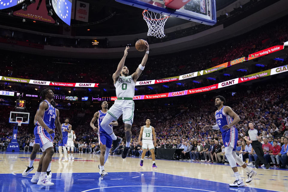Boston Celtics' Jayson Tatum (0) shoots against the Philadelphia 76ers in the first half of Game 6 of the Eastern Conference semifinals of the NBA basketball playoffs, Thursday, May 11, 2023, in Philadelphia.  (AP Photo/Matt Slocum)