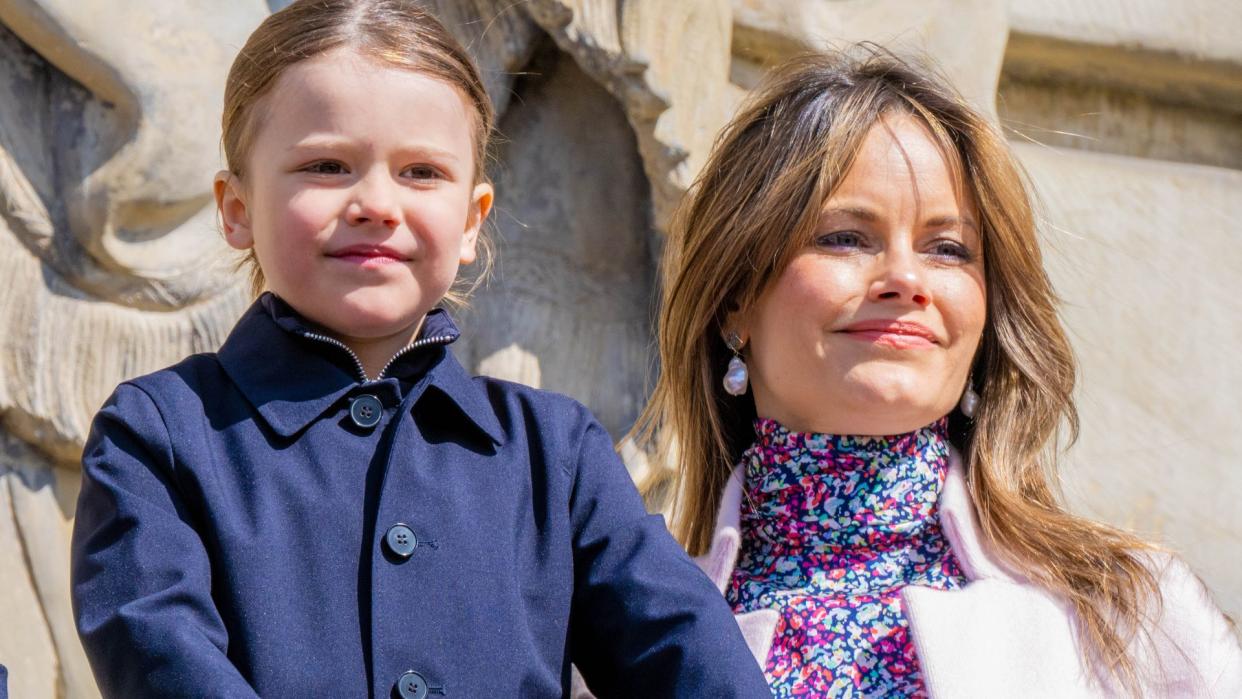 Princess Sofia in a floral dress with Prince Alexander in a blue coat