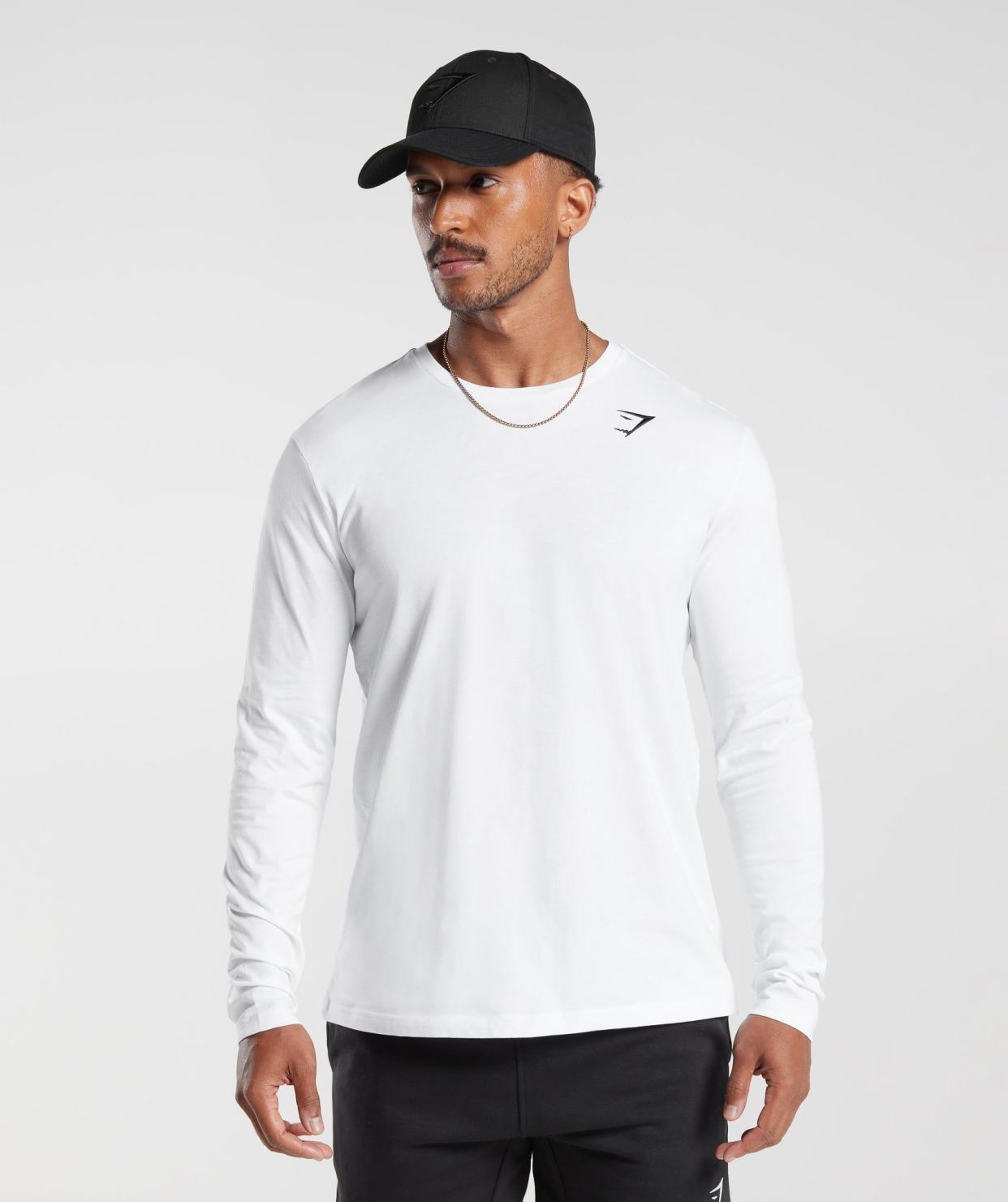 <p><a href="https://go.redirectingat.com?id=74968X1596630&url=https%3A%2F%2Fuk.gymshark.com%2Fproducts%2Fgymshark-crest-long-sleeve-t-shirt-white-ss22&sref=https%3A%2F%2F" rel="nofollow noopener" target="_blank" data-ylk="slk:Shop Now;elm:context_link;itc:0;sec:content-canvas" class="link rapid-noclick-resp">Shop Now</a></p><p>Crest Long Sleeve T-Shirt</p><p>gymshark.com</p><p>£15.40</p>