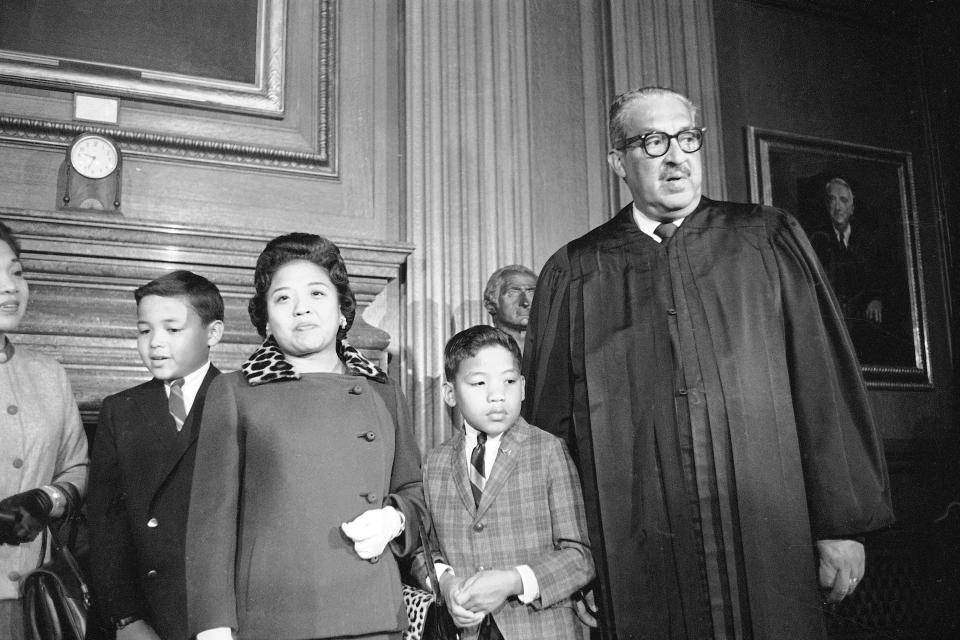 FILE - Supreme Court Associate Justice Thurgood Marshall, right, stands with his family as they watch him take his seat at the court for the first time, Oct. 2, 1967. From left are Marshall's son Thurgood, Jr., 11, wife Cecilia, and son John, 9. Marshall joined the Supreme Court in 1967 as the court's first Black justice. The Supreme Court Cecilia "Cissy" has died. She was 94.(AP Photo/Henry Griffin, File)