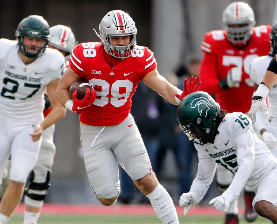 Ohio State Buckeyes tight end Jeremy Ruckert (88) heads up field after a catch against Michigan State Spartans safety Angelo Grose (15) in the second quarter during their NCAA College football game at Ohio Stadium in Columbus, Ohio on November 20, 2021. 