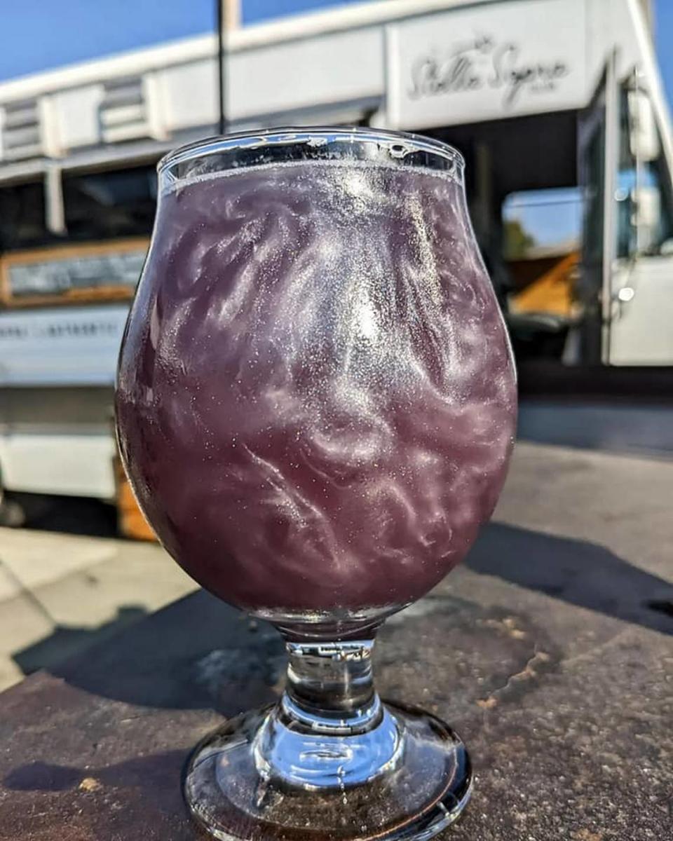 Menace Brewing’s new drink, “The Beer Formerly Known As,” is brewed with butterfly pea flower and topped off with edible glitter.