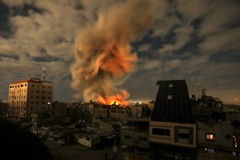 Smoke billows in the sky following Israeli bombardment on Alfaroq Mosque in a Rafah refugee camp in the southern Gaza Strip on Thursday. Photo by Ismael Mohamad/UPI