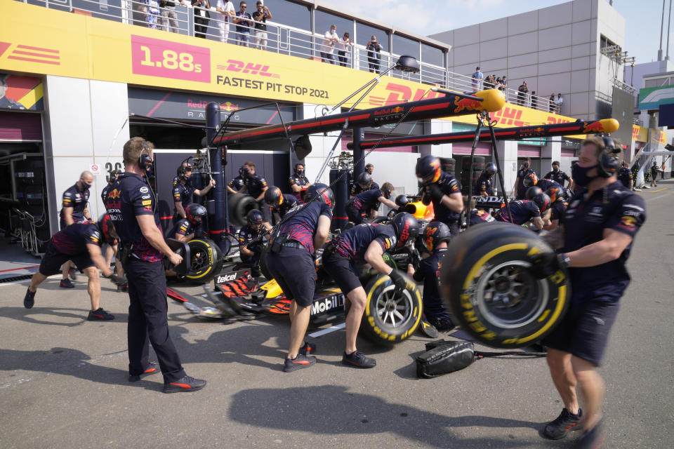 Red Bull team prepares for the first practice session Losail, Qatar, Friday Nov. 19, 2021 ahead of the Qatar Formula One Grand Prix. (AP Photo/Darko Bandic)