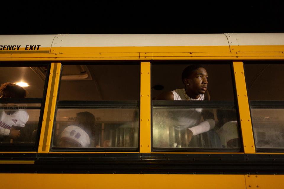 Mt. Pleasant High School football player Kahhlil Horton looks waits for his fellow teammates before riding home following a game against Summertown on Friday, Oct. 15, 2021.