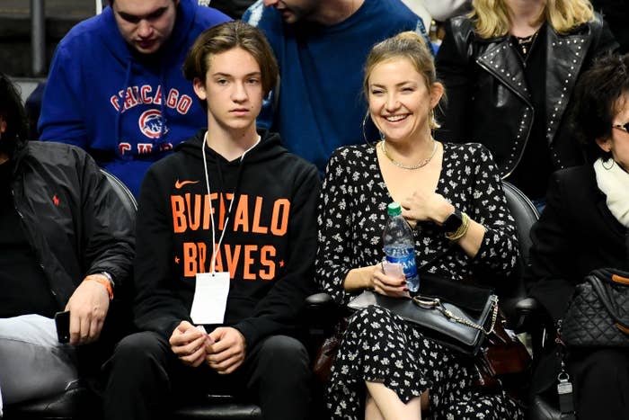Kate sitting at a sporting event with her son