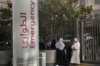 CORRECTS DAY TO TUESDAY WHEN INJURED Families of victims who were injured on Tuesday by their exploding handheld pagers, wait at the emergency entrance of the American University hospital, in Beirut, Lebanon, Wednesday, Sept. 18, 2024. (AP Photo/Hussein Malla)