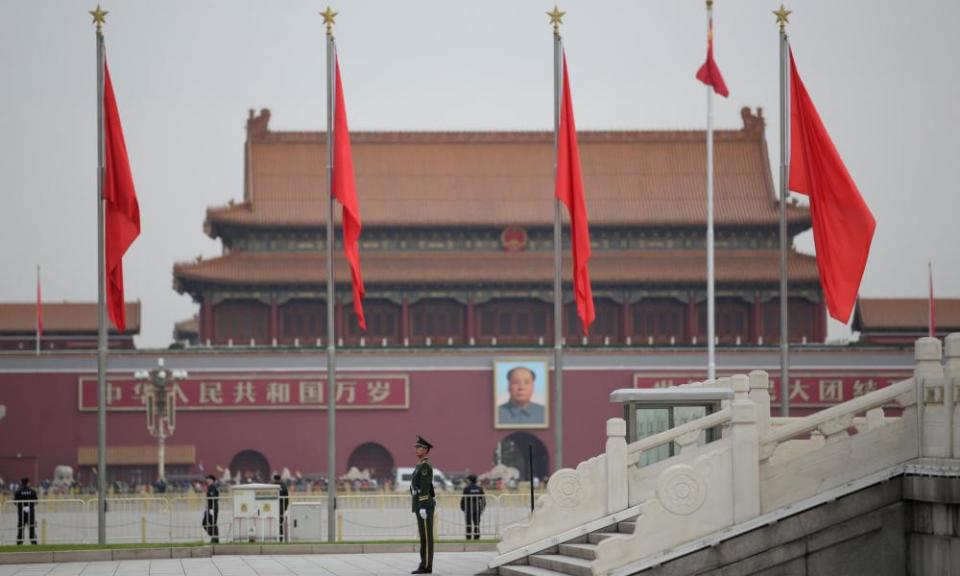 A paramilitary police officer stands guard at Tiananmen Square in Beijing.