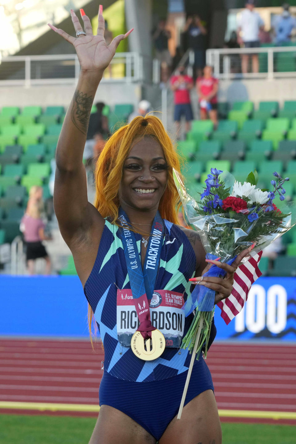 Richardson celebrates after winning the women's 100m at Olympic trials.