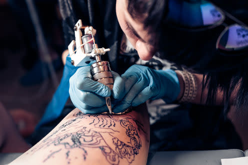 <span class="caption">Getting inked</span> <span class="attribution"><a class="link " href="http://www.shutterstock.com/pic-415460428/stock-photo-close-up-tattoo-artist-demonstrates-the-process-of-getting-black-tattoo-with-paint-master-works-in.html?src=5r8tR6LYjQiMqaTbO3s5aQ-1-14" rel="nofollow noopener" target="_blank" data-ylk="slk:IvanRiver/Shutterstock Inc;elm:context_link;itc:0;sec:content-canvas">IvanRiver/Shutterstock Inc</a></span>