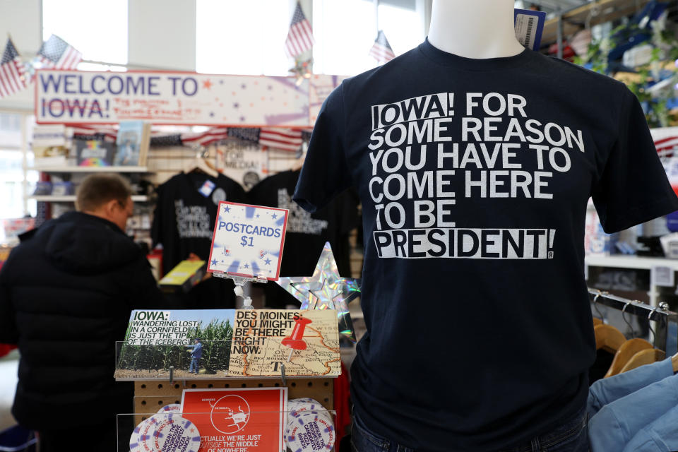 Interior of store with T-shirt on display that reads: Iowa! For some reason you have to come here to be president!