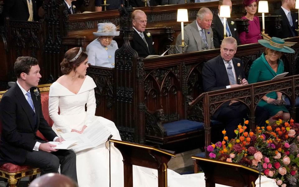 Britain's Queen Elizabeth II (3L), looks on as Britain's Princess Eugenie of York (2L) and Jack Brooksbank (L) look towards her parents Britain's Prince Andrew, Duke of York (2R) and Sarah, Duchess of York, during their wedding ceremony at St George's Chapel, Windsor Castle, in Windsor, on October 12, 2018. (Photo by Danny Lawson / POOL / AFP)        (Photo credit should read DANNY LAWSON/AFP/Getty Images)