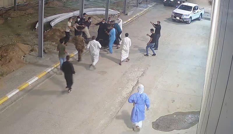 Relatives of a patient, who died from the coronavirus disease (COVID-19), beat up Tarik Sheibani, 47, an Iraqi doctor and director of Al-Amal Hospital, in this still image taken from CCTV footage obtained by Reuters, in Najaf