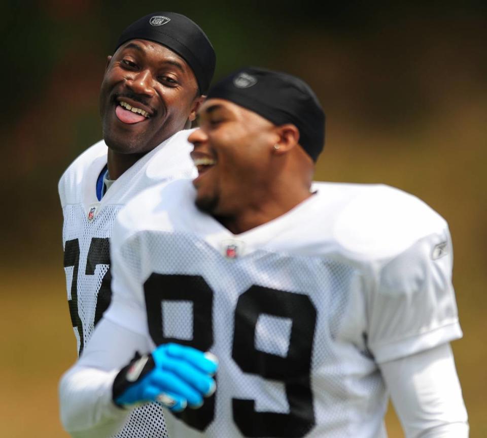 Carolina Panthers wide receivers (87) Muhsin Muhammad and (89) Steve Smith joke around as they prepare for practice on Aug. 6, 2009, at training camp in Spartanburg, S.C.