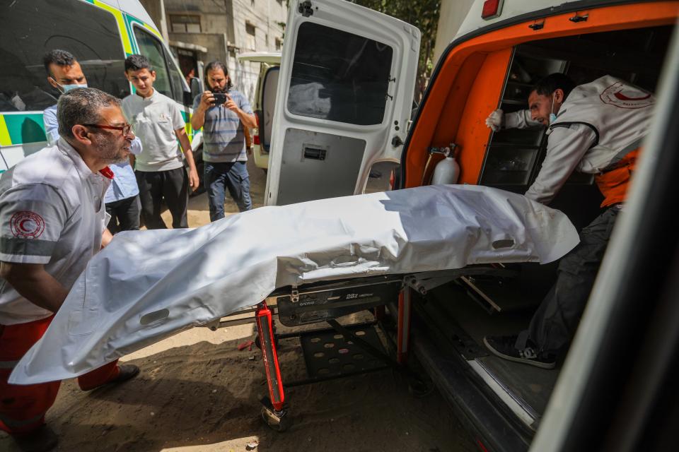 Medics prepare the bodies of World Central Kitchen workers, who were killed in Israeli air strikes, for their return to their home counties on April 3, 2024 in Rafah, Gaza. In a statement, the charity World Central Kitchen said that seven of its workers were killed by an Israeli air strike while driving in a convoy after leaving a warehouse in Deir al-Balah, in central Gaza. Israel issued a rare apology over the incident, calling their deaths a "grave mistake." The killed workers included both Palestinians and foreigners.