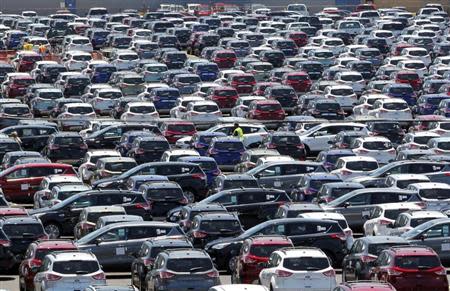 Newly assembled 2013 Ford Escapes sit on plant lots ready to be shipped out to dealers at the newly transformed Louisville Assembly Plant in Louisville, Kentucky, June 13, 2012. REUTERS/John Sommers II