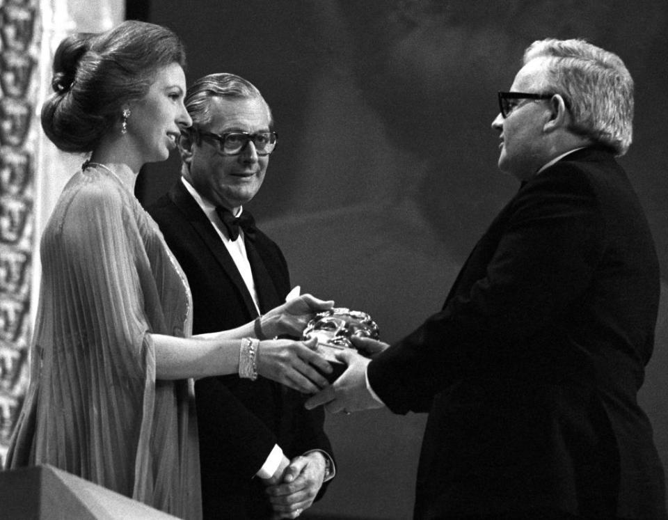 <p>The Queen's daughter presents comedian Ronny Barker with a BAFTA in 1977.</p>