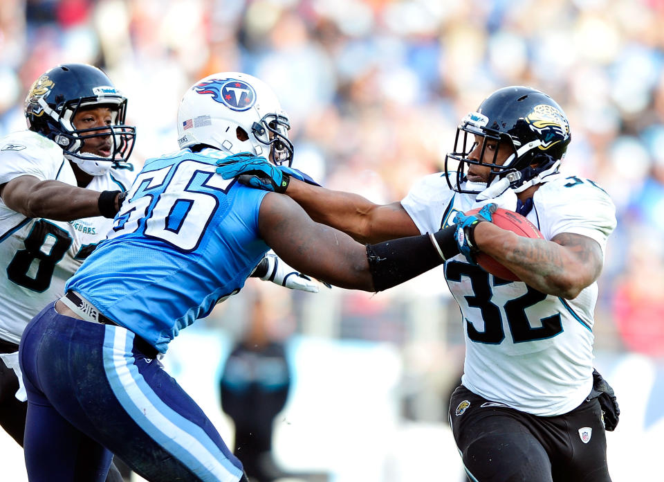 Maurice Jones-Drew #32 of the Jacksonville Jaguars runs against Akeem Ayers #56 of the Tennessee Titans during play at LP Field on December 24, 2011 in Nashville, Tennessee. The Titans won 23-17. (Photo by Grant Halverson/Getty Images)