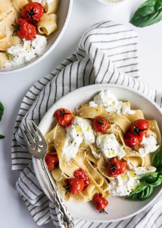 <p>Pina Bresciani</p><p>The flavors of the burrata, tomatoes and fresh basil are a classic combination and the flavors work amazingly well together.</p><p><strong>Get the recipe: <a href="https://pinabresciani.com/pappardelle-burrata-burst-cherry-tomatoes/" rel="nofollow noopener" target="_blank" data-ylk="slk:Burst Cherry Tomato Pasta with Creamy Burrata;elm:context_link;itc:0;sec:content-canvas" class="link "><em>Burst Cherry Tomato Pasta with Creamy Burrata</em></a></strong></p>