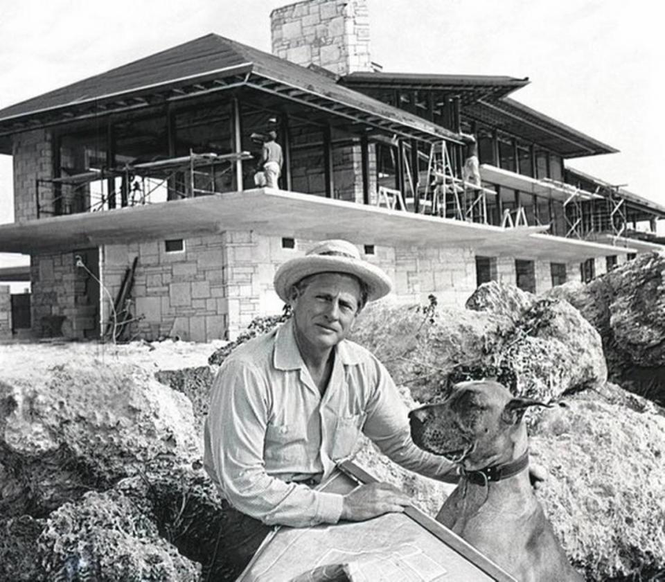 Architect Alfred Browning Parker pauses with dog Fury while working on the home he designed for his family in Coral Gables. New owners have applied to tear down the 1963 house, widely regarded as an architectural masterpiece.
