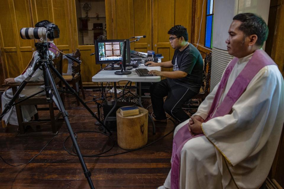 A Catholic priest prepares to hold mass over internet livestream at a chapel as authorities ban religious gatherings amid the threat of the coronavirus on March 22, 2020 in Manila, Philippines.