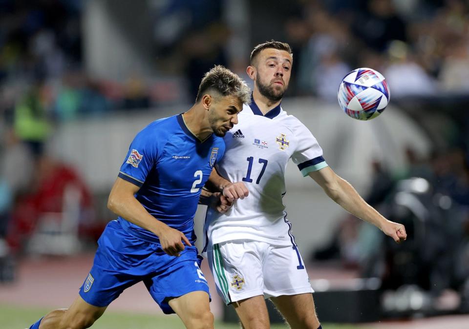 Conor McMenamin (right) in action for Northern Ireland away to Kosovo (Valdrin Xhemaj/AP). (PA Wire)