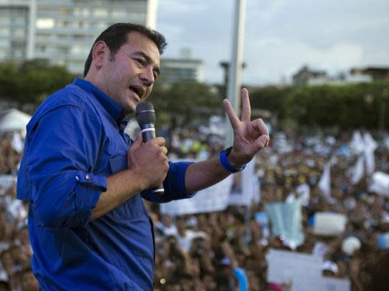 Former president Jimmy Morales speaks to supporters during a campaign rally in Guatemala City (AP)