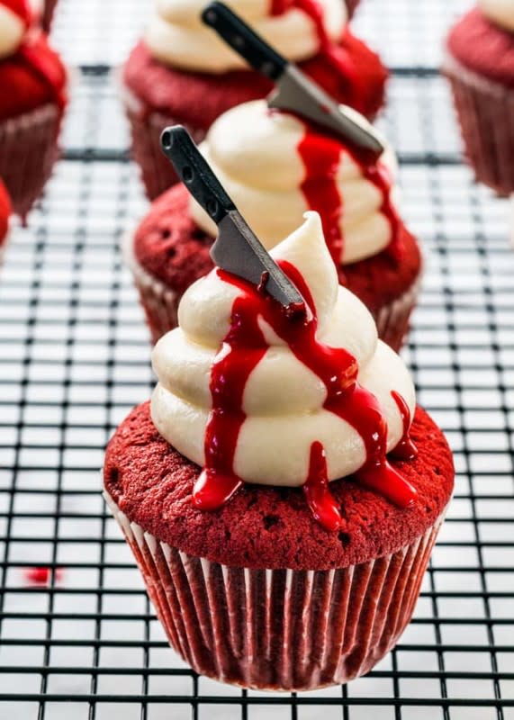 <p>Red velvet cupcakes are a natural fit for the Halloween dessert table. These cupcakes take it up a notch with a red icing decoration for an extra bloody effect. </p><p><strong>Get the recipe: </strong><a href="https://www.jocooks.com/recipes/halloween-red-velvet-cupcakes/" rel="nofollow noopener" target="_blank" data-ylk="slk:Halloween Red Velvet Cupcakes;elm:context_link;itc:0;sec:content-canvas" class="link ">Halloween Red Velvet Cupcakes</a></p>