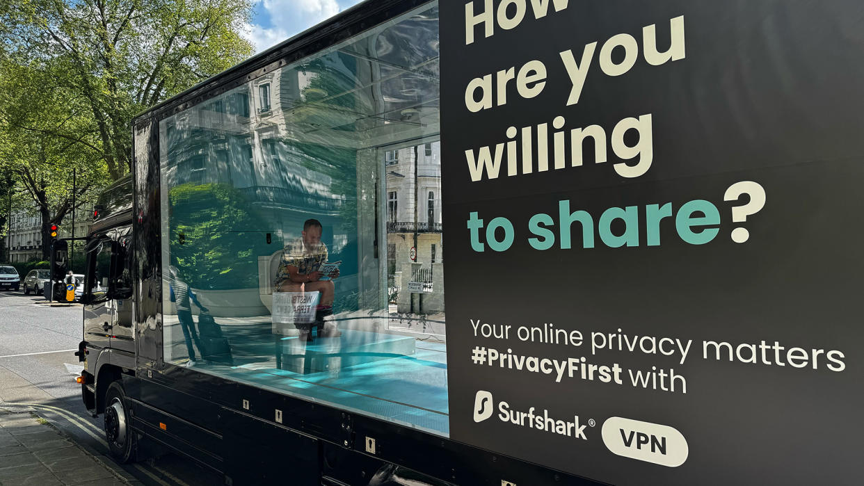  Surfshark's truck featuring a transparent toilet and a person inside in London, in front of Future PLC's office on May 9, 2024. . 