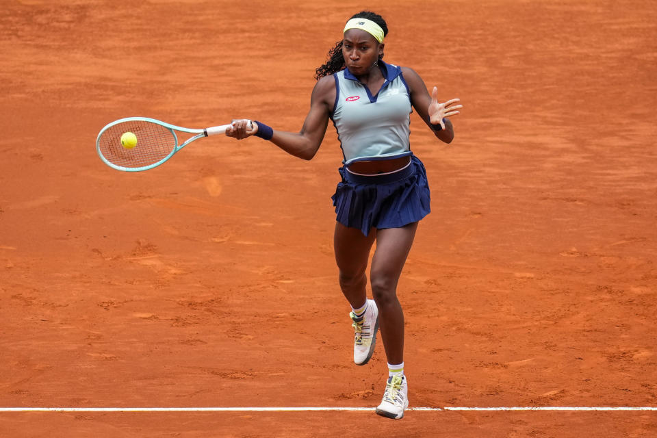 Coco Gauff of the United States returns the ball to Arantxa Rus of Netherlands during the Mutua Madrid Open tennis tournament in Madrid, Thursday, April 25, 2024. (AP Photo/Manu Fernandez)