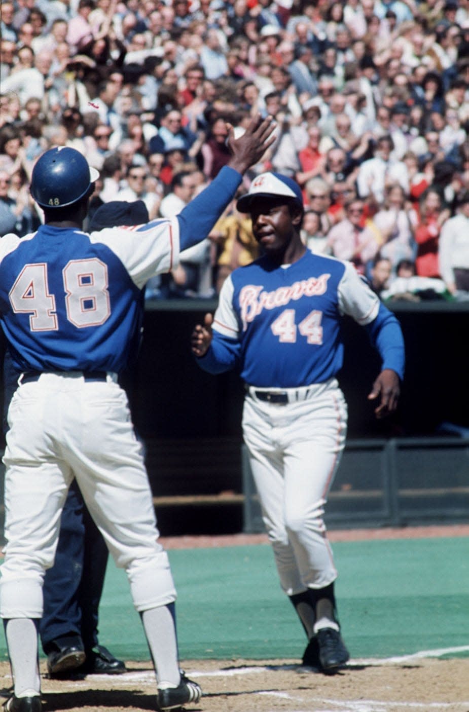 Hank Aaron crosses home plate after bashing home run No. 714 at Riverfront Stadium to tie Babe Ruth’s record, April 4, 1974. The Enquirer/Bob Free
