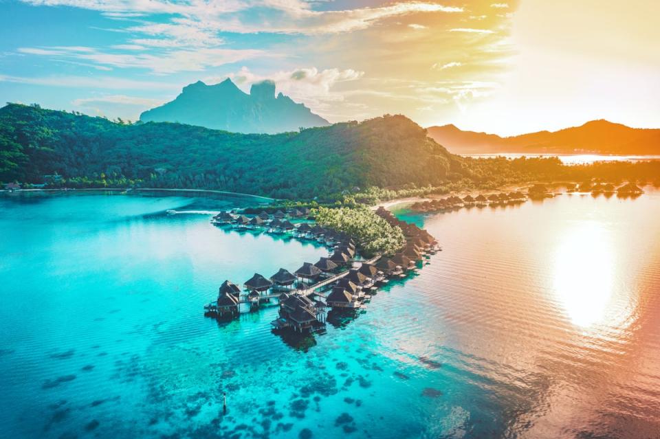 Villages of overwater bungalows dot the South Pacific in Bora Bora (Getty Images/iStockphoto)