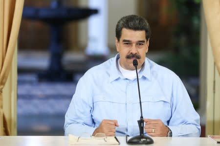 Venezuela's President Nicolas Maduro takes part in a meeting with members of the government at Miraflores Palace in Caracas