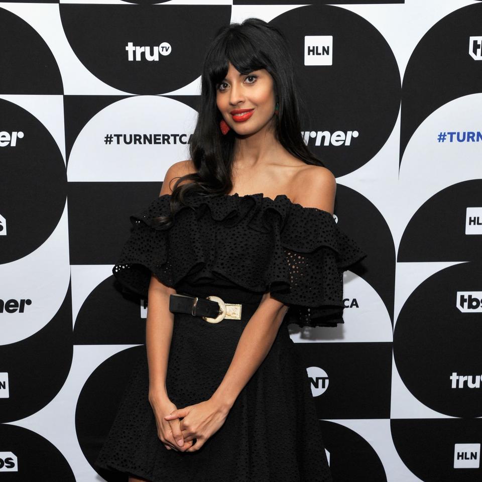 Jameela Jamil stuns in this black net low-cut dress that shows her perfect legs