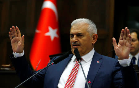 Turkey's new Prime Minister Binali Yildirim addresses members of parliament from his ruling AK Party (AKP) during a meeting at the Turkish parliament in Ankara, Turkey, May 24, 2016. REUTERS/Umit Bektas