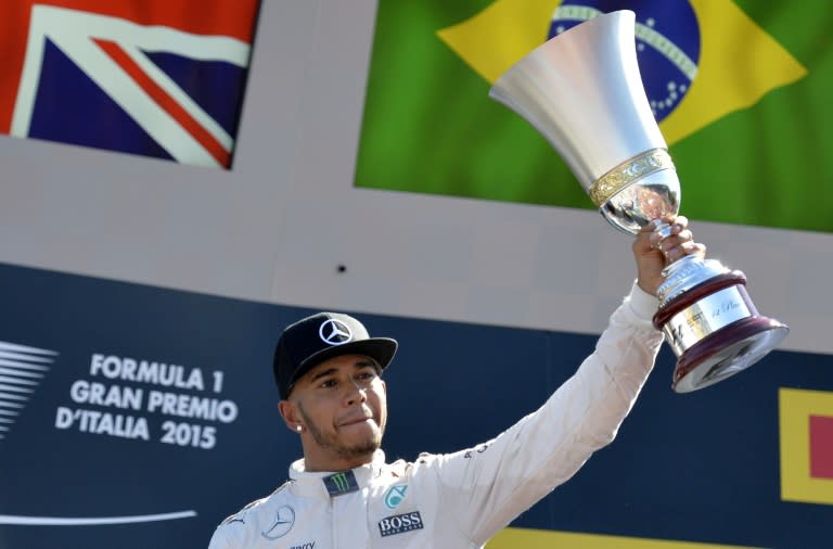 Monza, Italy. 2 September 2018. Formula One Grand Prix of Italy, race day;  Mercedes AMG Petronas Motorsport, Lewis Hamilton holds his trophy on the  podium as he wins the race Credit: Action