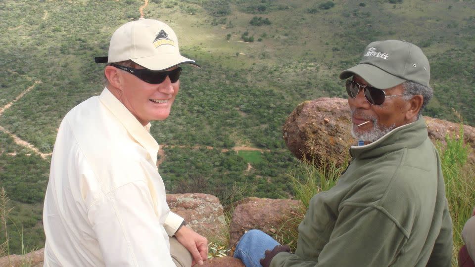 Peet Cilliers and Morgan Freeman admire the view from atop Hanglip Mountain. - Courtesy Legend Hospitality Group