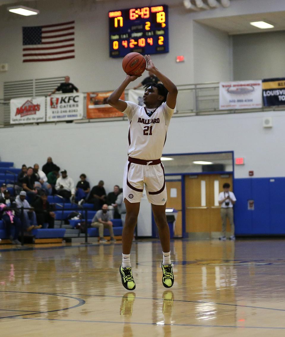 Ballard's Gabe Sisk (21) dropped in a three pointer against the St. Xavier defense during their matchup in the Boys LIT at Valley High School on Wednesday night. Ballard edged out St. Xaiver 60-57. Jan. 11, 2023