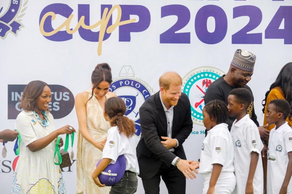 Prince Harry and Markle during their trip to Nigeria. Getty Images for The Archewell Foundation